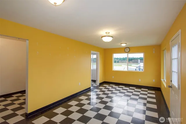 a view of a room with a black and white checkered floor
