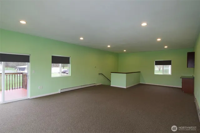 a balcony with next to a yard