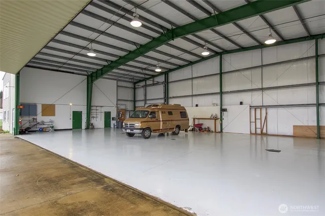 a bathroom with a sink mirror and toilet