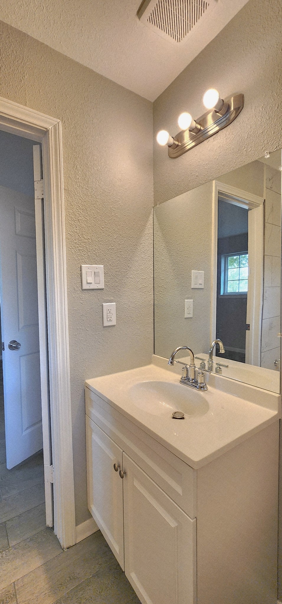5914 Newquay Street Houston, TX 77085 - Photo 14 of 43 a bathroom with a sink and a mirror