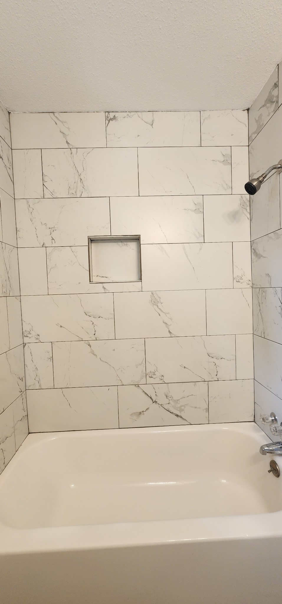 5914 Newquay Street Houston, TX 77085 - Photo 15 of 43 a bathroom with a bathtub