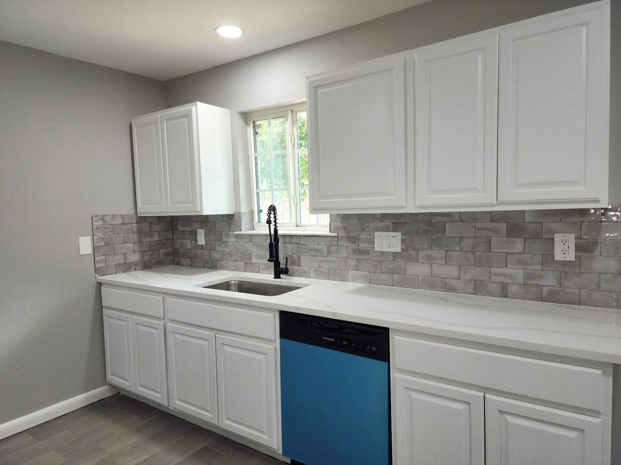 5914 Newquay Street Houston, TX 77085 - Photo 23 of 43 a kitchen with a sink cabinets and window