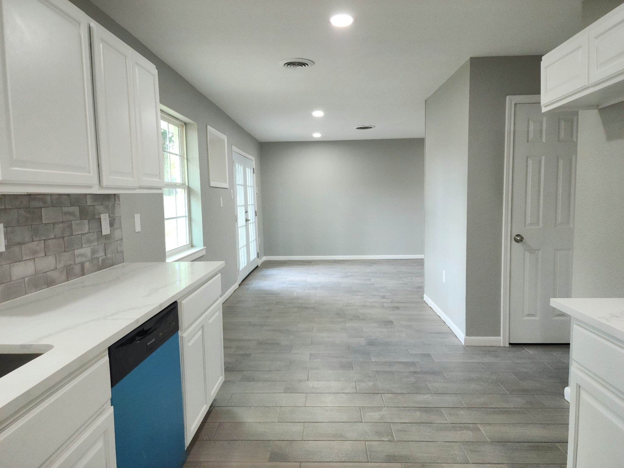 5914 Newquay Street Houston, TX 77085 - Photo 25 of 43 a view of a kitchen with a sink and a window