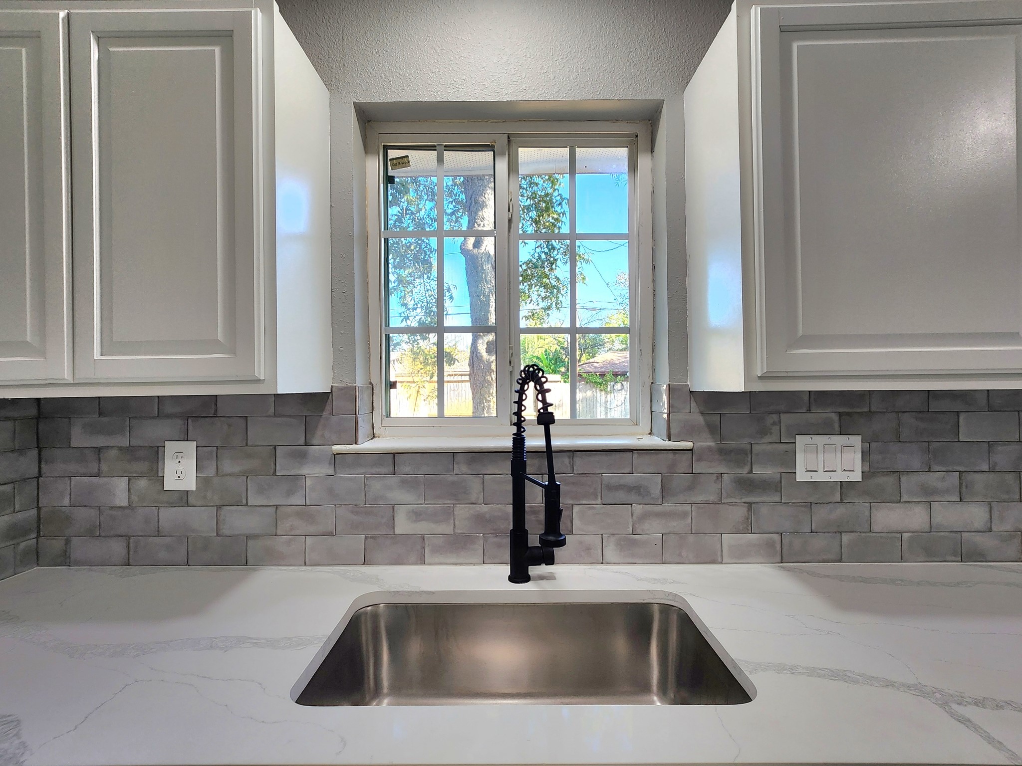 5914 Newquay Street Houston, TX 77085 - Photo 27 of 43 a close view of a sink and dishwasher in a kitchen