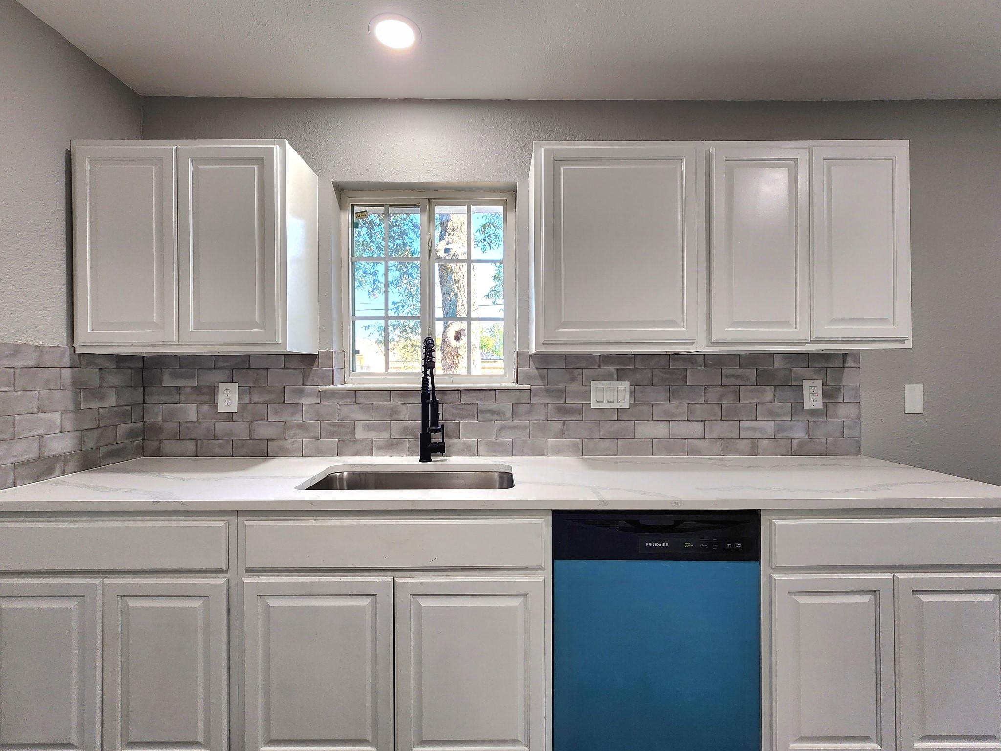 5914 Newquay Street Houston, TX 77085 - Photo 28 of 43 a kitchen with stainless steel appliances granite countertop a sink a stove and cabinets
