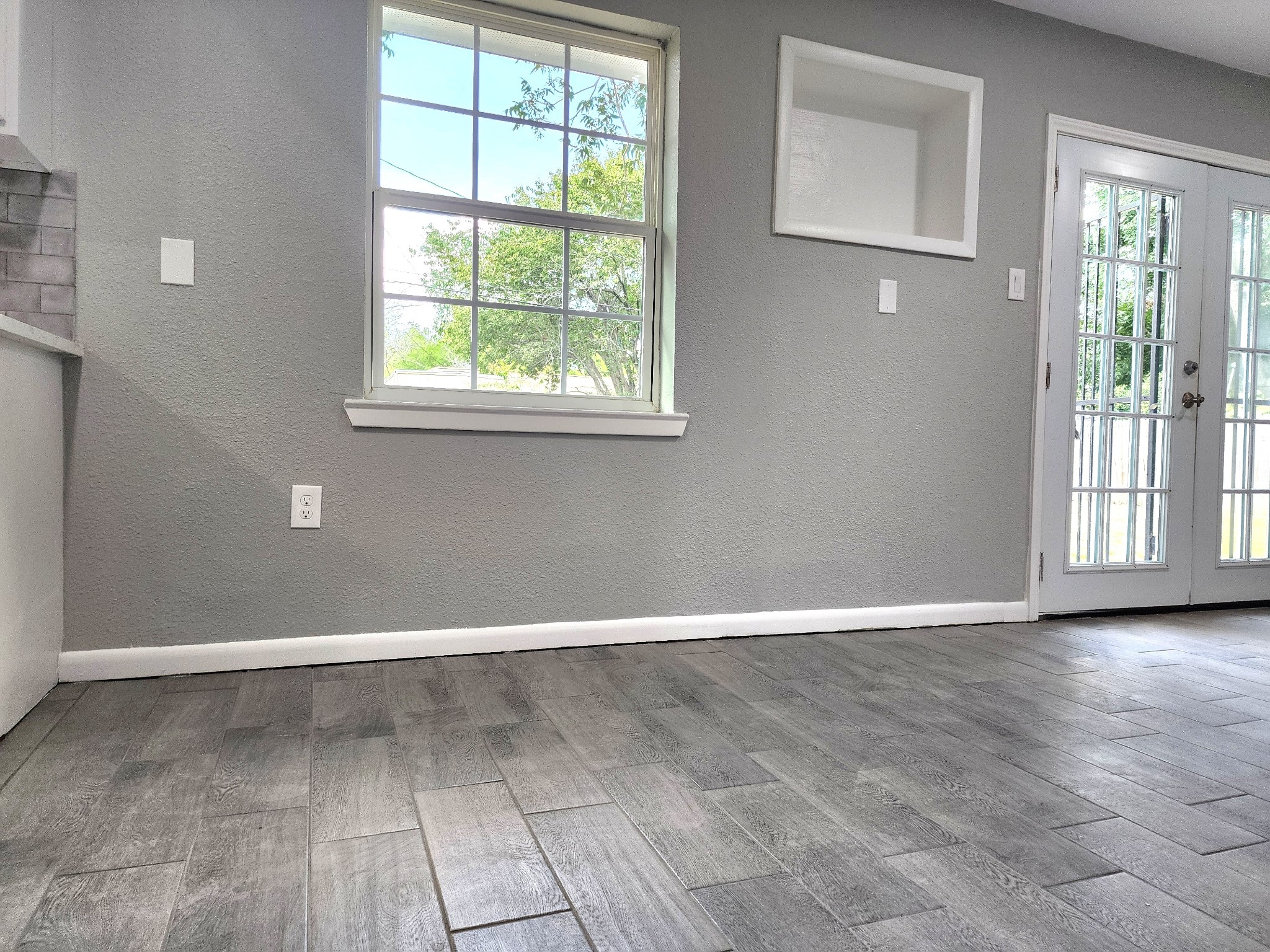 5914 Newquay Street Houston, TX 77085 - Photo 30 of 43 an empty room with wooden floor and windows