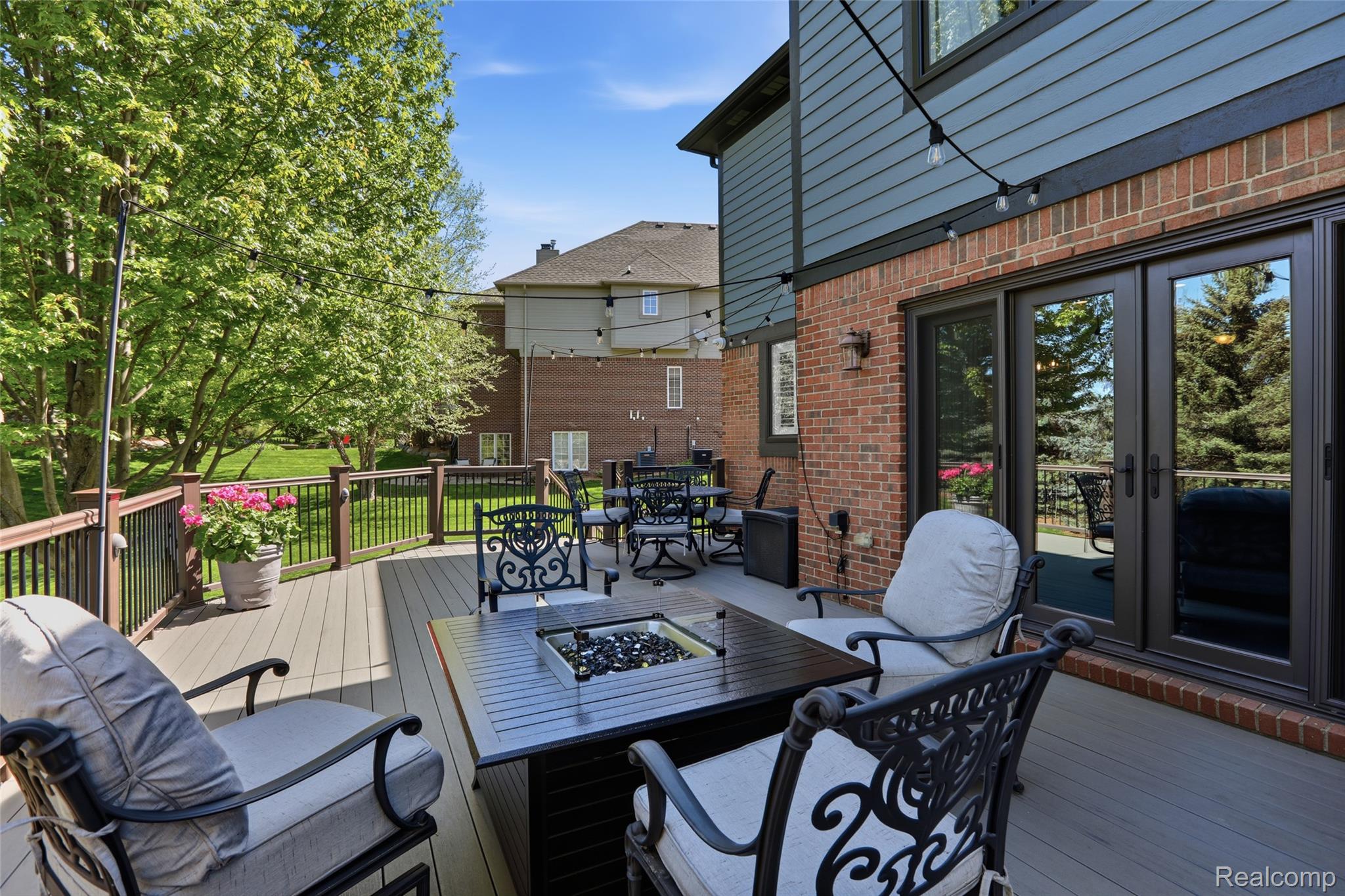 668 Springview Drive Rochester, MI 48307 - Photo 78 of 90 Wooden deck featuring a fire pit, outdoor dining space, and a grill