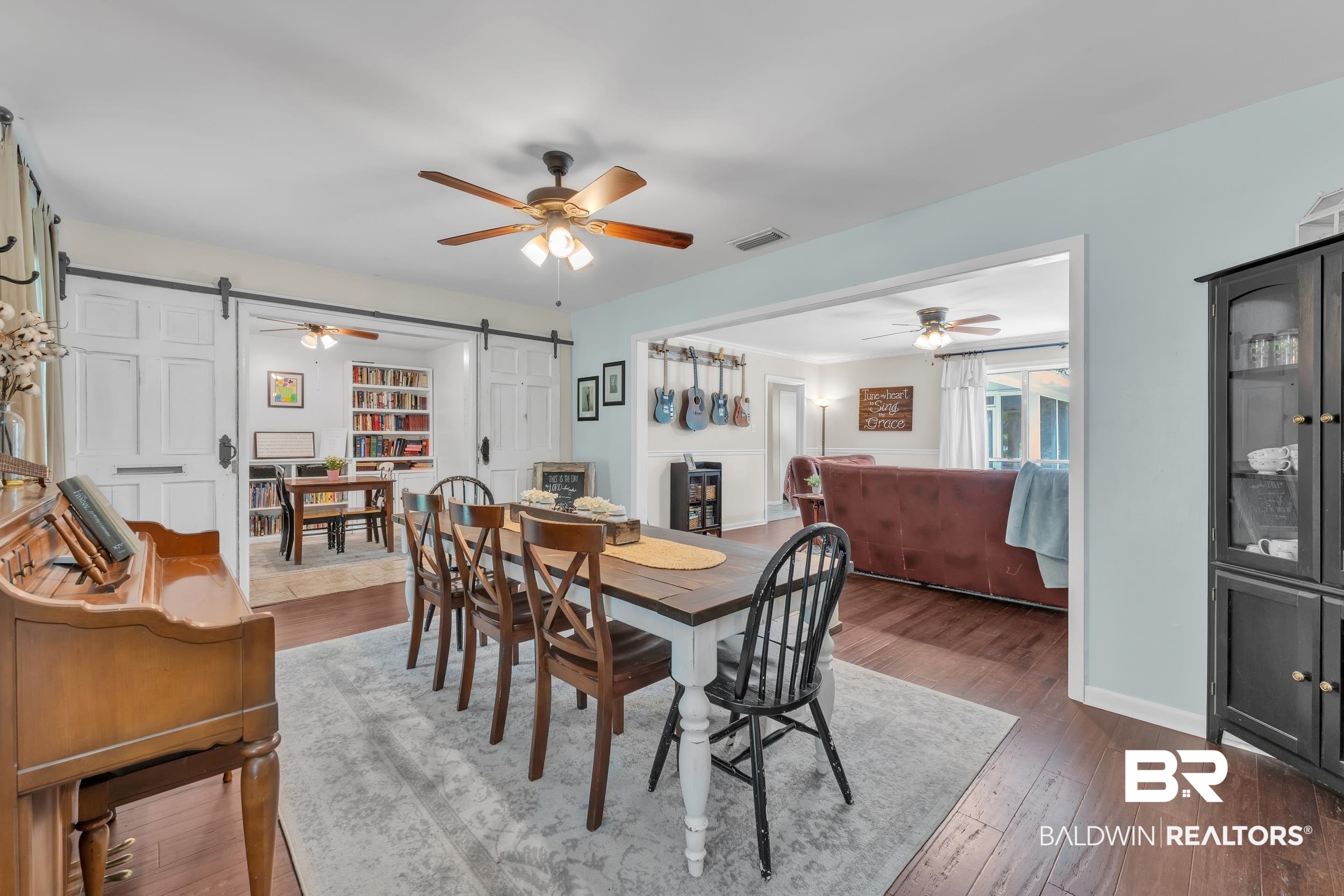 224 Cache Circle Mobile, AL 36611 - Photo 6 of 42 Dining area with a barn door, ceiling fan, dark wood finished floors, and baseboards