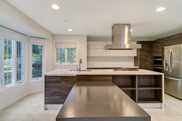 1000 Laurie Lane Burr Ridge, IL 60527 - Photo 12 of 36 a kitchen with kitchen island granite countertop a sink appliances and cabinets