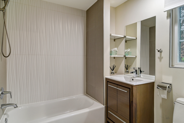 1000 Laurie Lane Burr Ridge, IL 60527 - Photo 17 of 36 a bathroom with a sink and a mirror