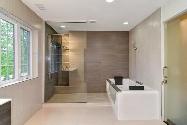 1000 Laurie Lane Burr Ridge, IL 60527 - Photo 20 of 36 a bathroom with a bathtub and a shower