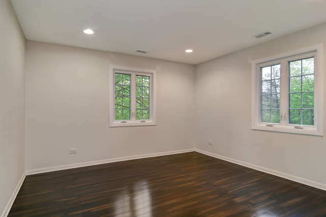 1000 Laurie Lane Burr Ridge, IL 60527 - Photo 25 of 36 a view of empty room with wooden floor and fan
