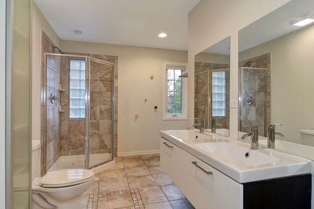 1000 Laurie Lane Burr Ridge, IL 60527 - Photo 26 of 36 a bathroom with a double vanity sink toilet and shower