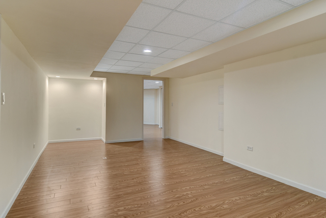 1000 Laurie Lane Burr Ridge, IL 60527 - Photo 31 of 36 a view of an empty room with wooden floor