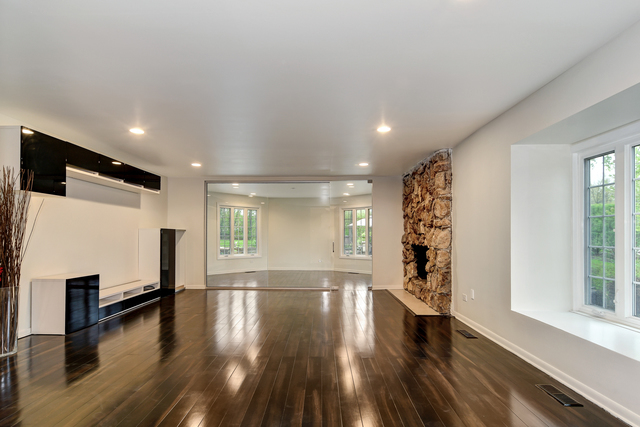 1000 Laurie Lane Burr Ridge, IL 60527 - Photo 5 of 36 a view of an empty room with wooden floor and a window