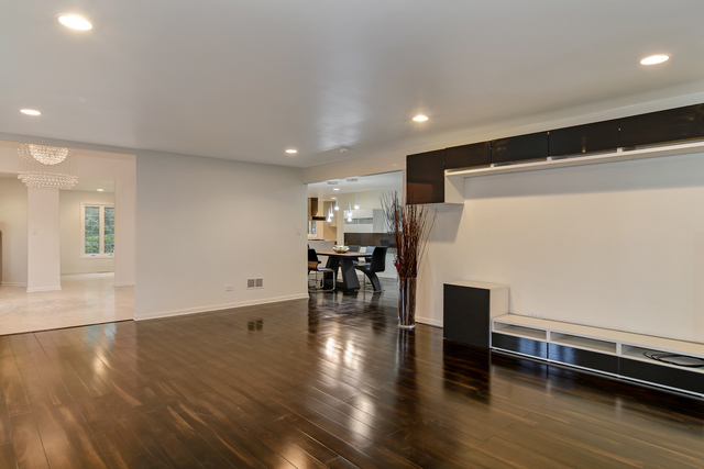 1000 Laurie Lane Burr Ridge, IL 60527 - Photo 8 of 36 a living room with dining room and wooden floor