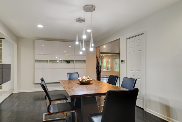 1000 Laurie Lane Burr Ridge, IL 60527 - Photo 10 of 36 a view of a dining room with furniture and wooden floor