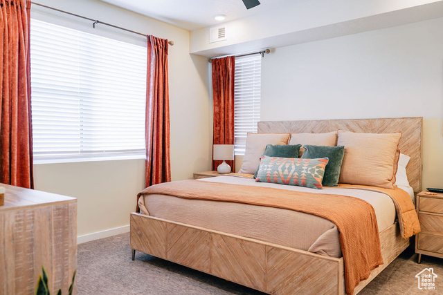 961 West Akoya Pearl Road, Unit 201 St. George, UT 84790 - Photo 17 of 67 Bedroom with carpet floors, multiple windows, and a ceiling fan