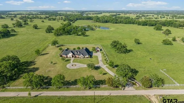a view of a lake with a big yard