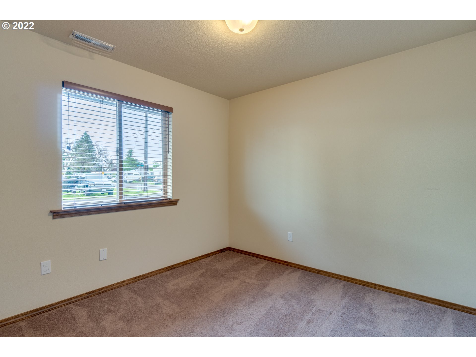 10923 Rees Street Northeast Donald, OR 97020 - Photo 15 of 27 an empty room with windows