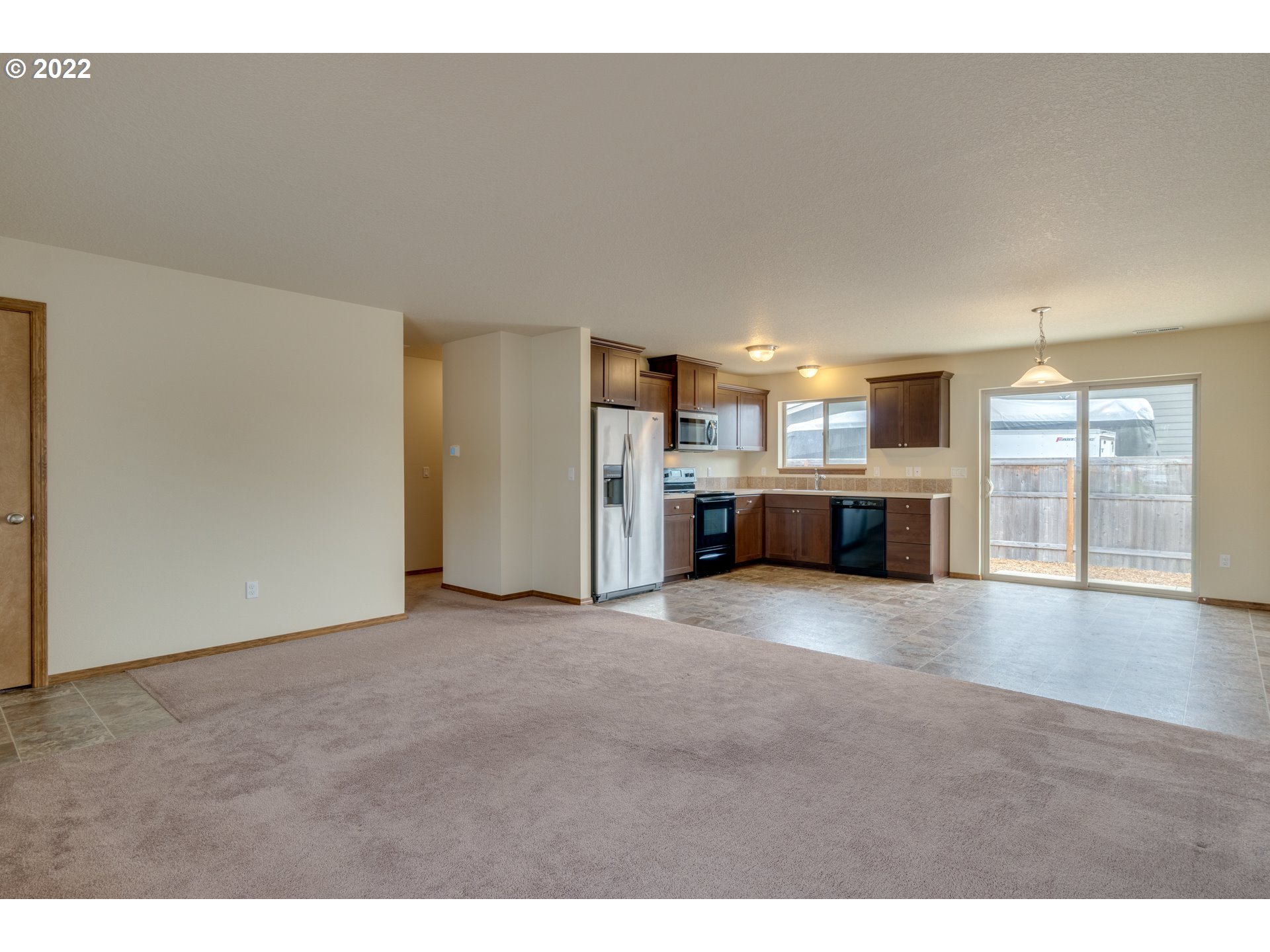 10923 Rees Street Northeast Donald, OR 97020 - Photo 6 of 27 a view of a kitchen with a sink and a stove top oven