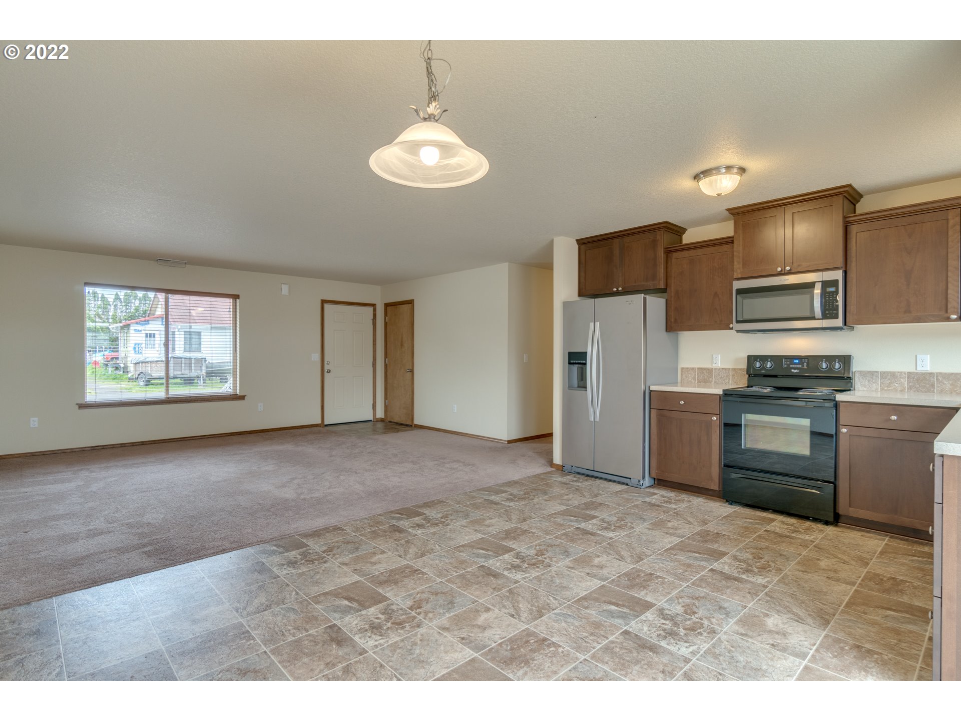 10923 Rees Street Northeast Donald, OR 97020 - Photo 10 of 27 a view of kitchen with refrigerator and microwave