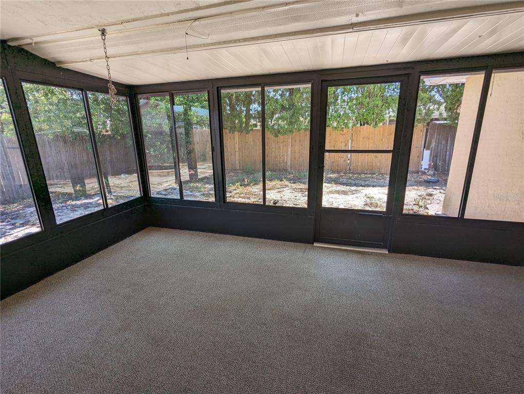 11230 Kapok Avenue Port Richey, FL 34668 - Photo 18 of 19 a view of an empty room with a window