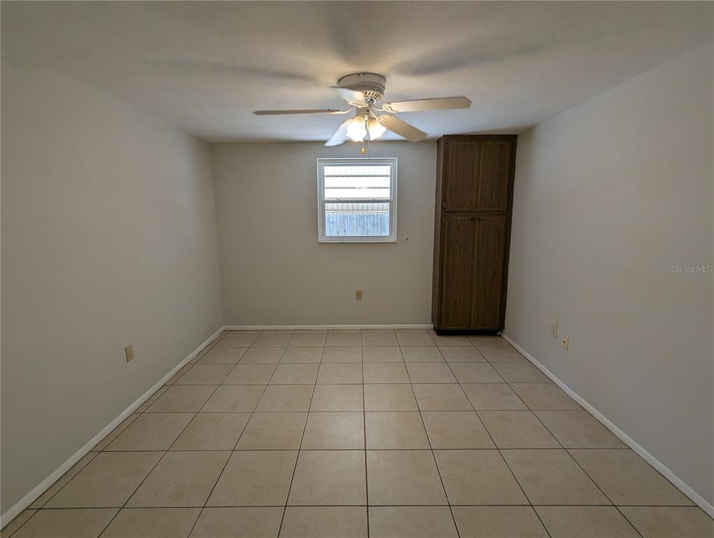 11230 Kapok Avenue Port Richey, FL 34668 - Photo 8 of 19 a view of an empty room with a window