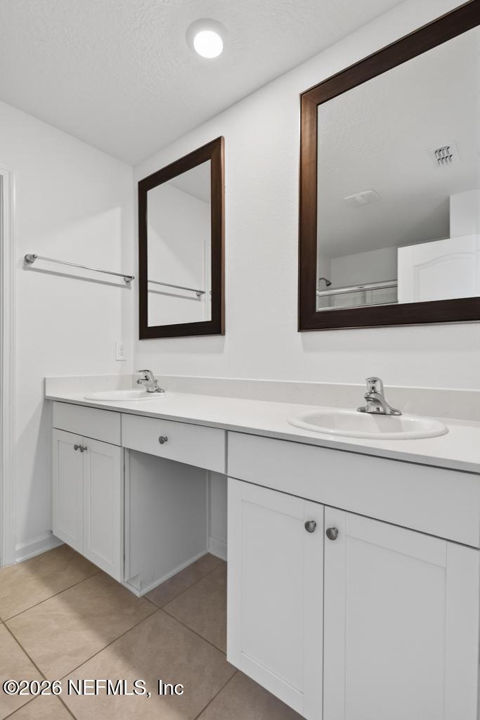 45 Seaport Breeze Road St. Augustine, FL 32095 - Photo 71 of 88 a bathroom with a sink and a mirror