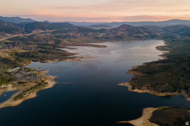 9269 North Sunset Road Kamas, UT 84036 - Photo 20 of 21 Expansive lake with surrounding land featuring a marina, docks, and nearby mountainous terrain