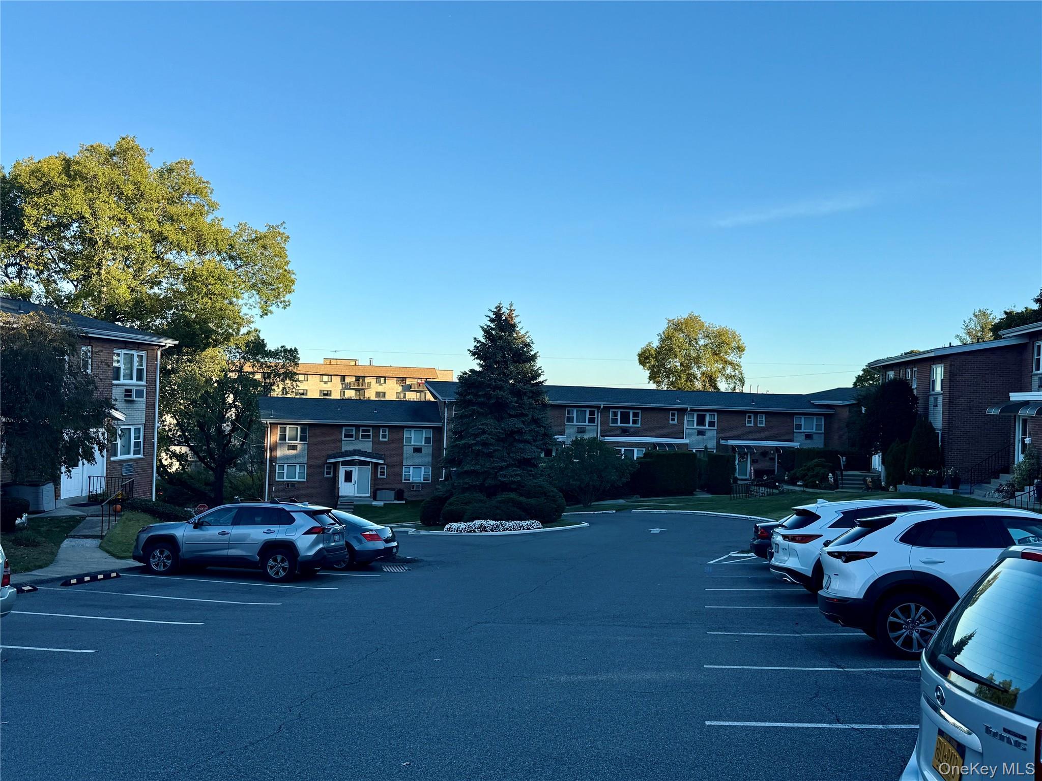 669 Pelham Road, Unit C10 New Rochelle, NY 10805 - Photo 12 of 13 a car parked in front of a house