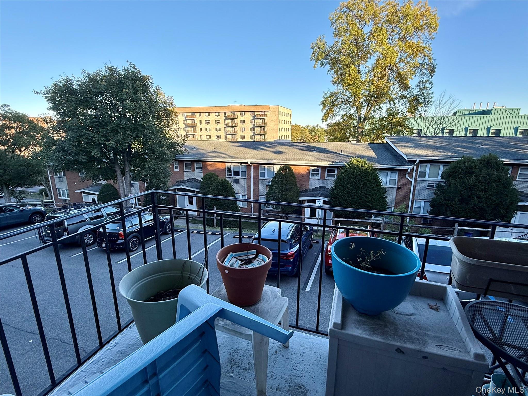 669 Pelham Road, Unit C10 New Rochelle, NY 10805 - Photo 6 of 13 a view of a patio with couches chairs and potted plants