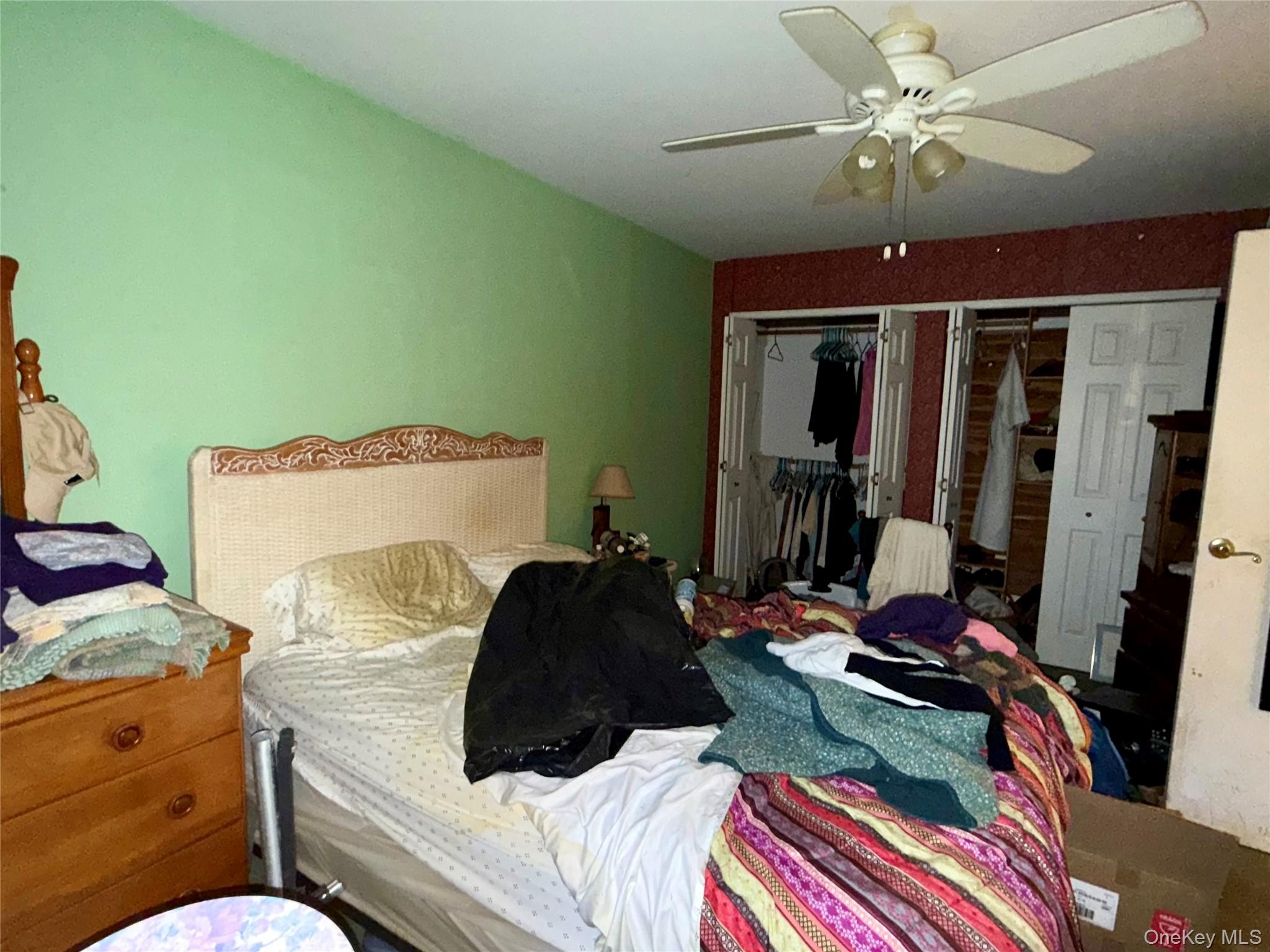 669 Pelham Road, Unit C10 New Rochelle, NY 10805 - Photo 8 of 13 a bedroom with a bed and ceiling fan