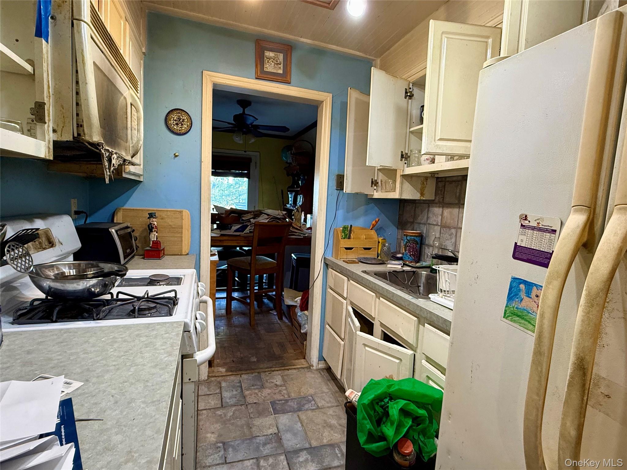 669 Pelham Road, Unit C10 New Rochelle, NY 10805 - Photo 10 of 13 a kitchen with stainless steel appliances granite countertop a refrigerator and a stove