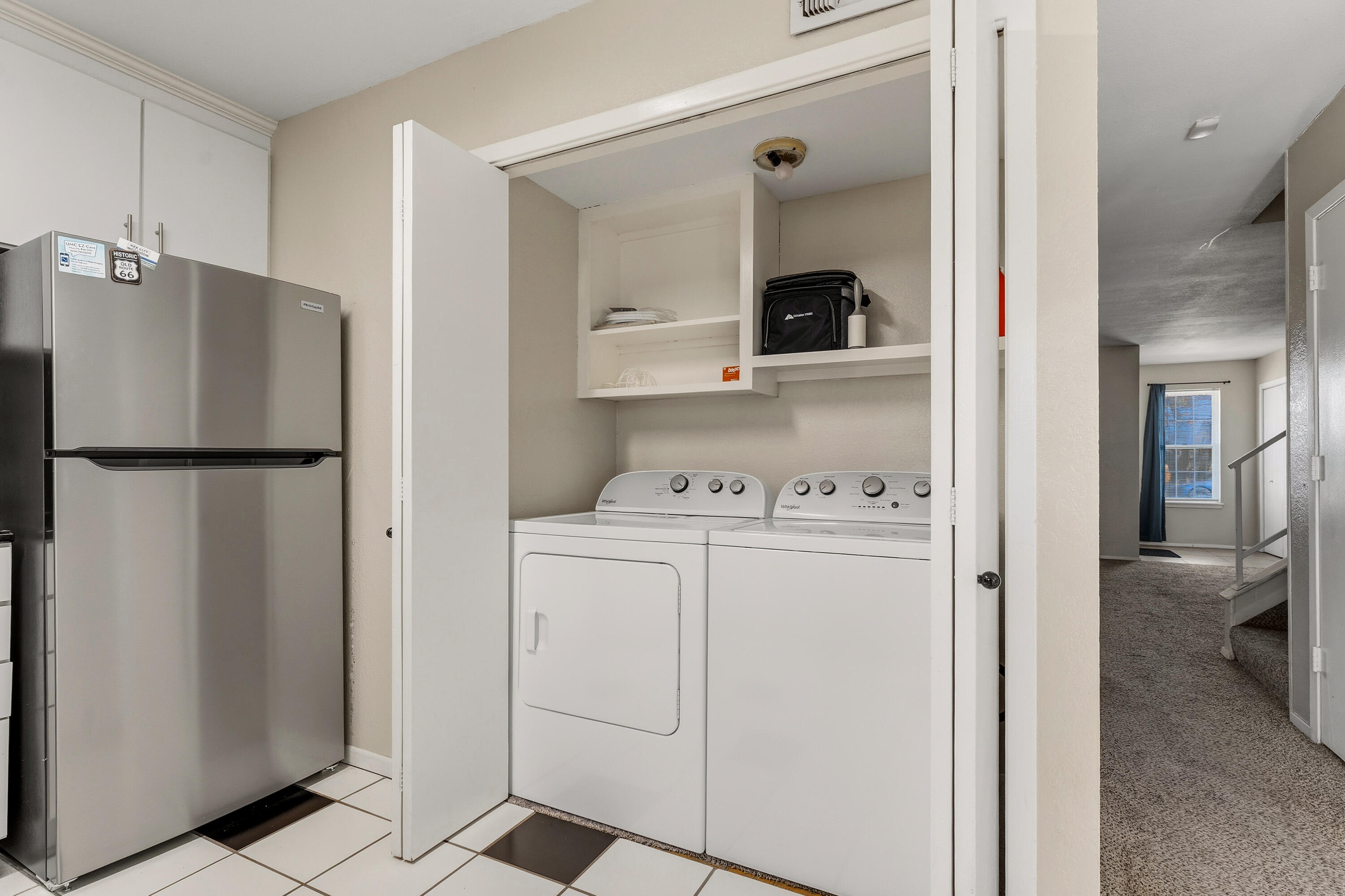 4725 48th Street Lubbock, TX 79414 - Photo 12 of 24 a view of kitchen with refrigerator and white cabinets
