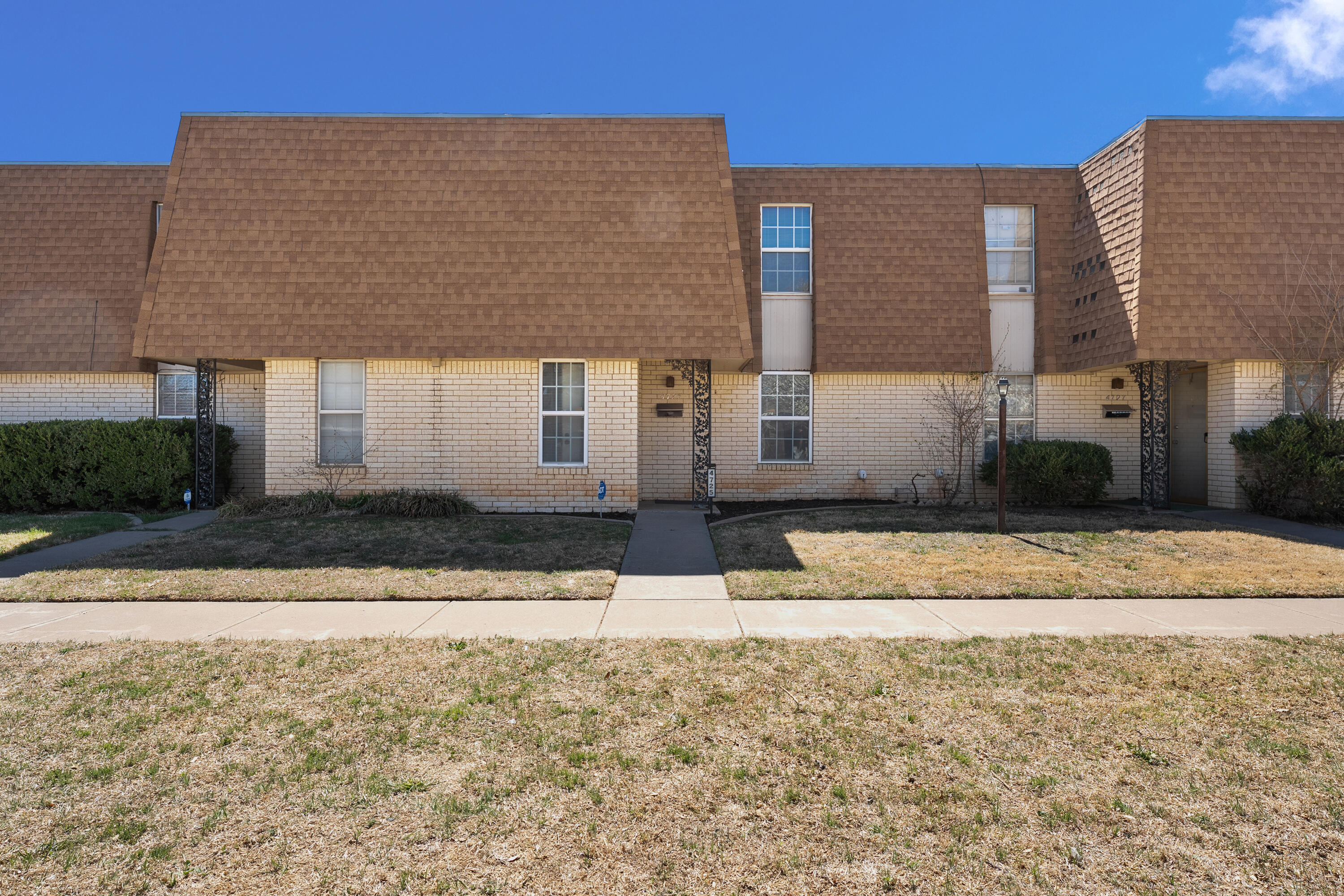 4725 48th Street Lubbock, TX 79414 - Photo 2 of 24 a front view of a house with a yard