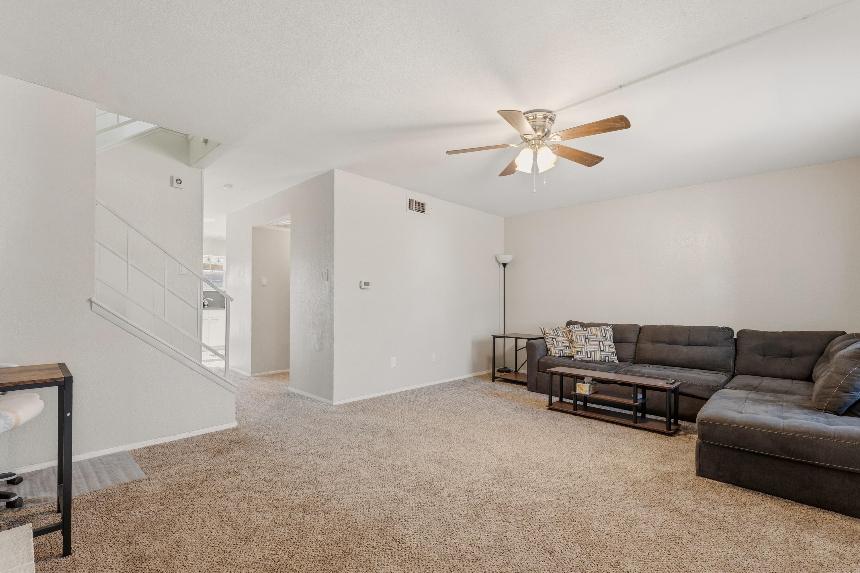 4725 48th Street Lubbock, TX 79414 - Photo 6 of 24 a living room with furniture and a ceiling fan