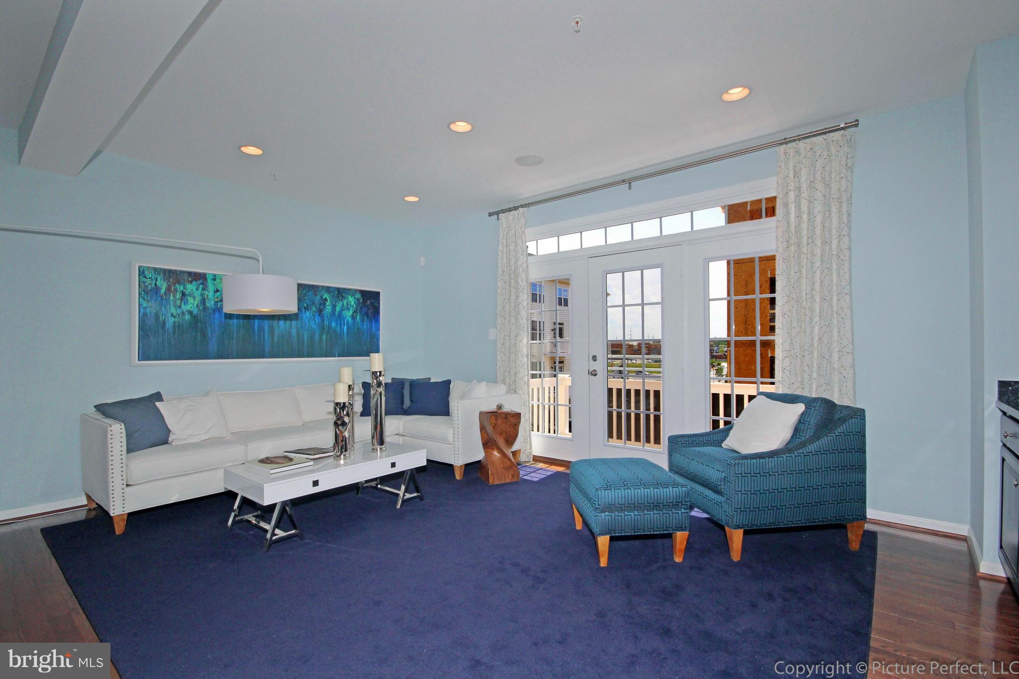 112 Mill Pond Road Frederick, MD 21701 - Photo 12 of 23 a living room with furniture and wooden floor