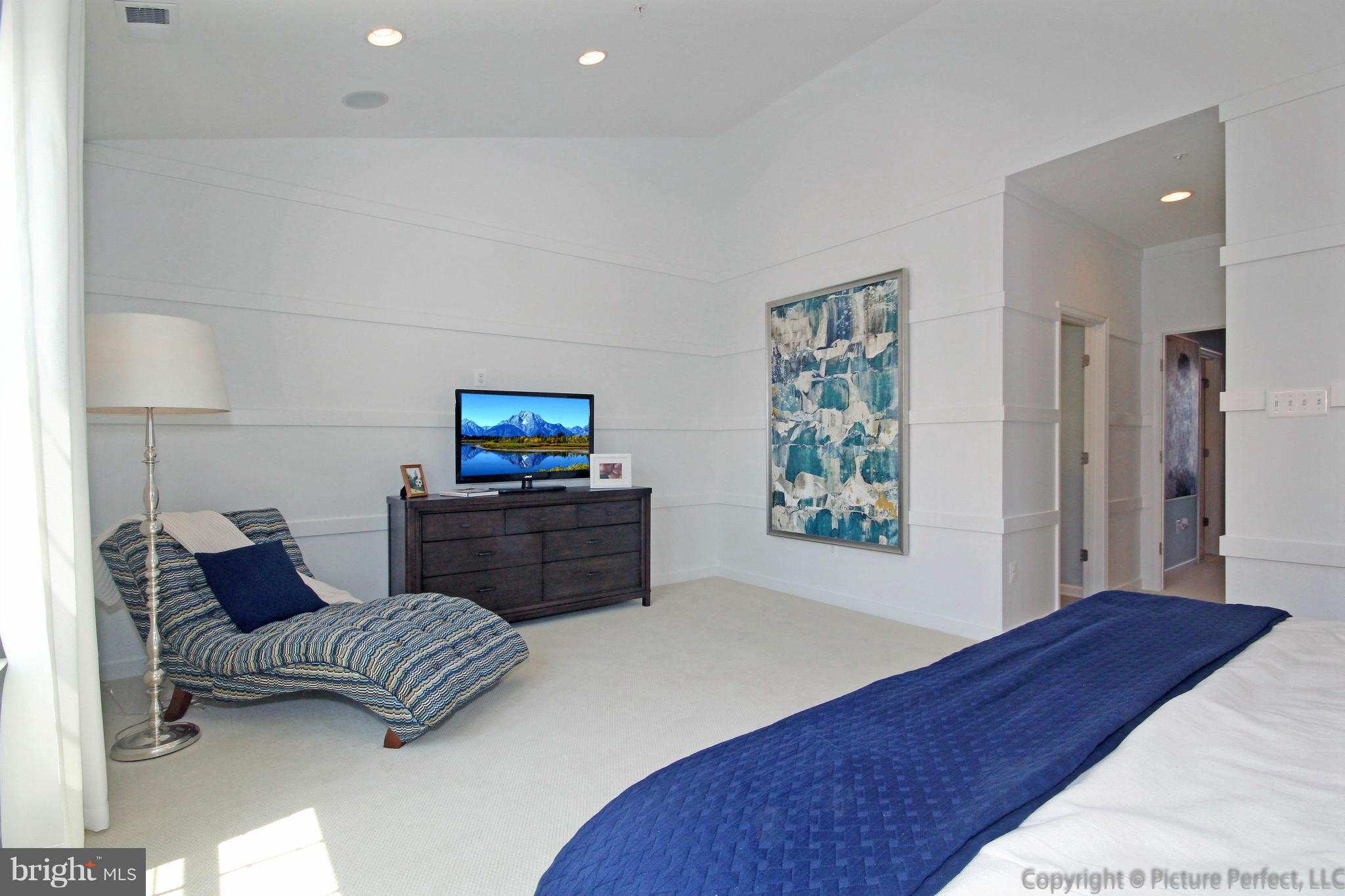 112 Mill Pond Road Frederick, MD 21701 - Photo 14 of 23 a bedroom with a bed and a chair