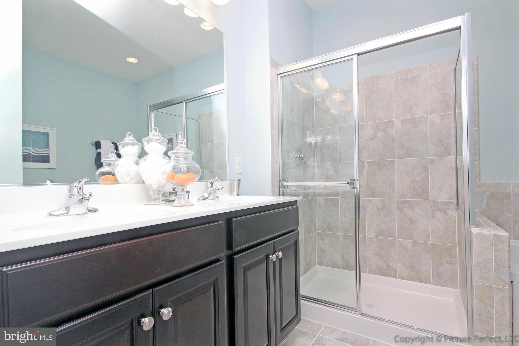 112 Mill Pond Road Frederick, MD 21701 - Photo 15 of 23 a bathroom with a sink and a mirror