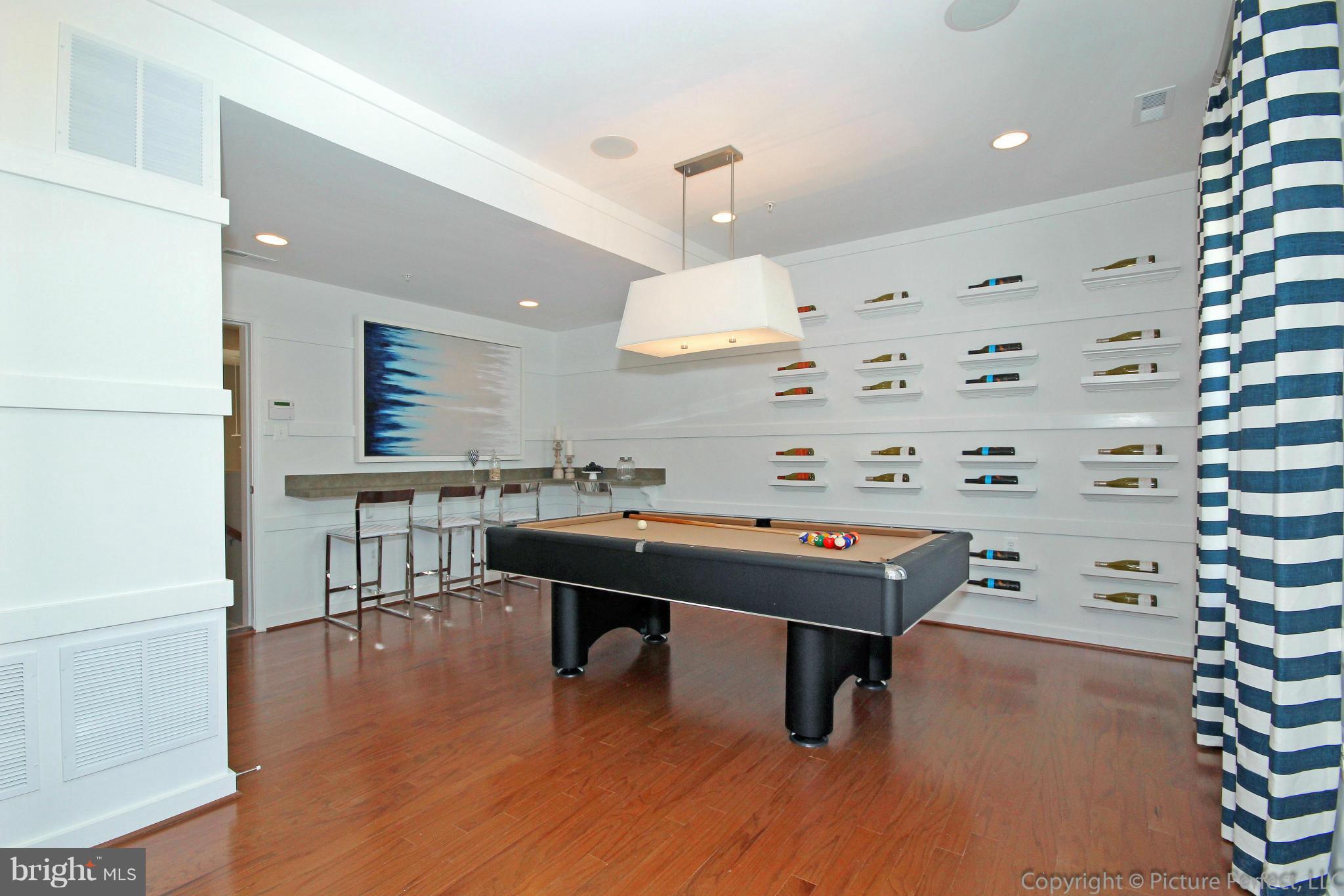 112 Mill Pond Road Frederick, MD 21701 - Photo 20 of 23 a room with furniture and wooden floor