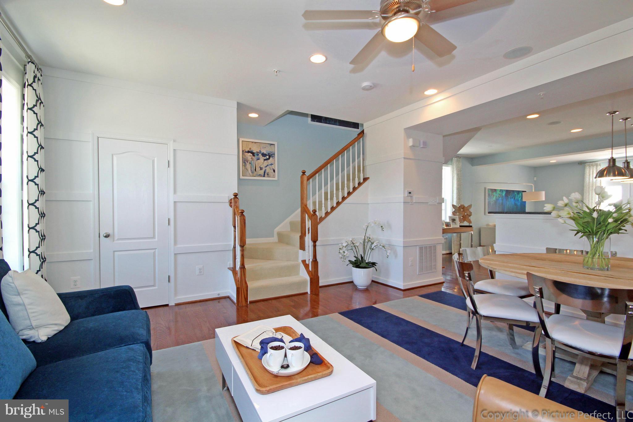 112 Mill Pond Road Frederick, MD 21701 - Photo 4 of 23 a living room with furniture and a wooden floor