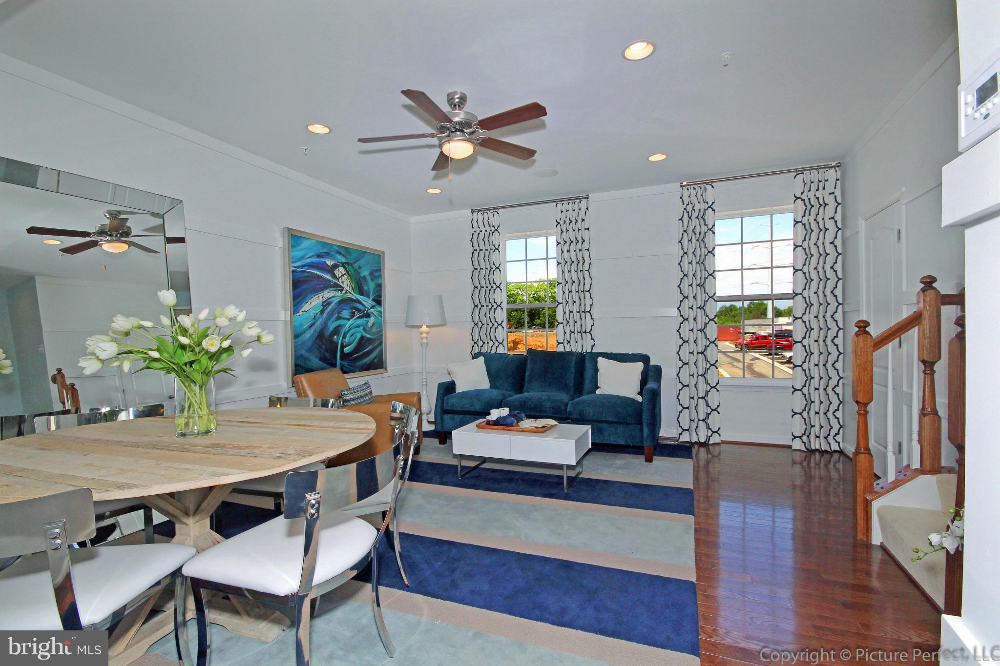 112 Mill Pond Road Frederick, MD 21701 - Photo 5 of 23 a living room with furniture and a wooden floor