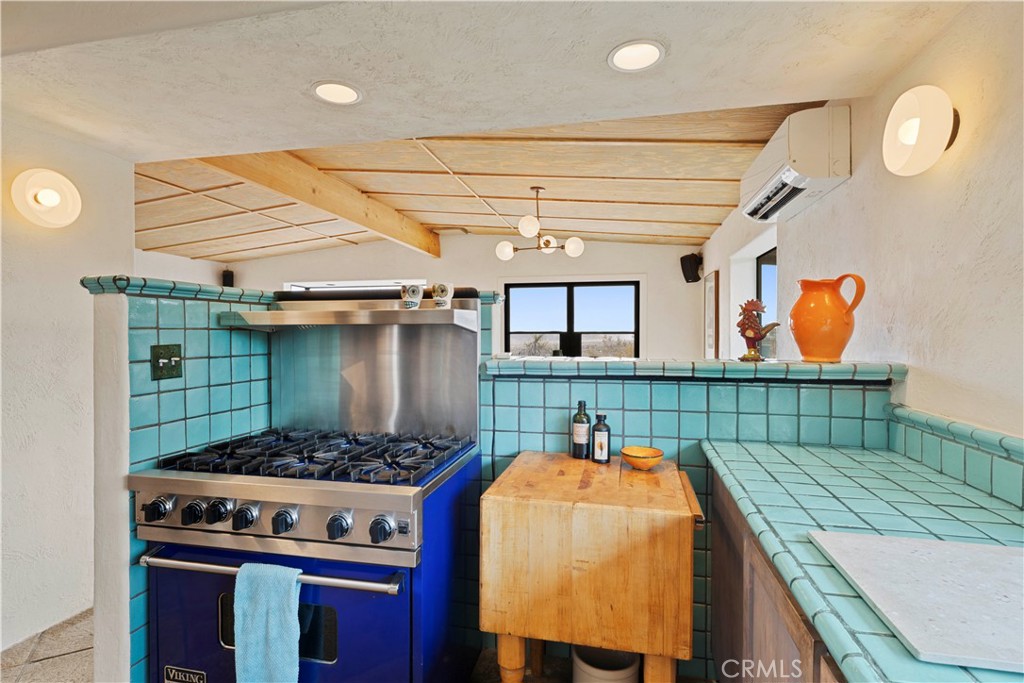 51222 Gamma Gulch Road Landers, CA 92285 - Photo 17 of 73 a utility room with stainless steel appliances lots of appliances