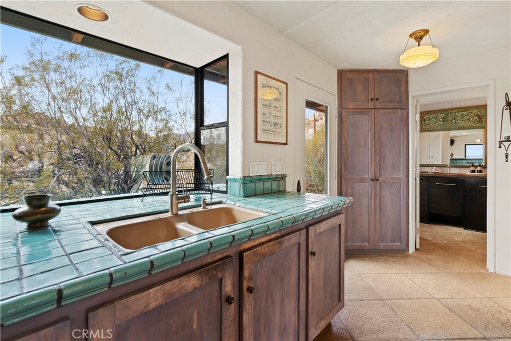 51222 Gamma Gulch Road Landers, CA 92285 - Photo 19 of 73 a kitchen with a sink and cabinets