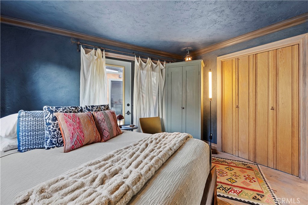 51222 Gamma Gulch Road Landers, CA 92285 - Photo 27 of 73 a bedroom with a large bed and a window