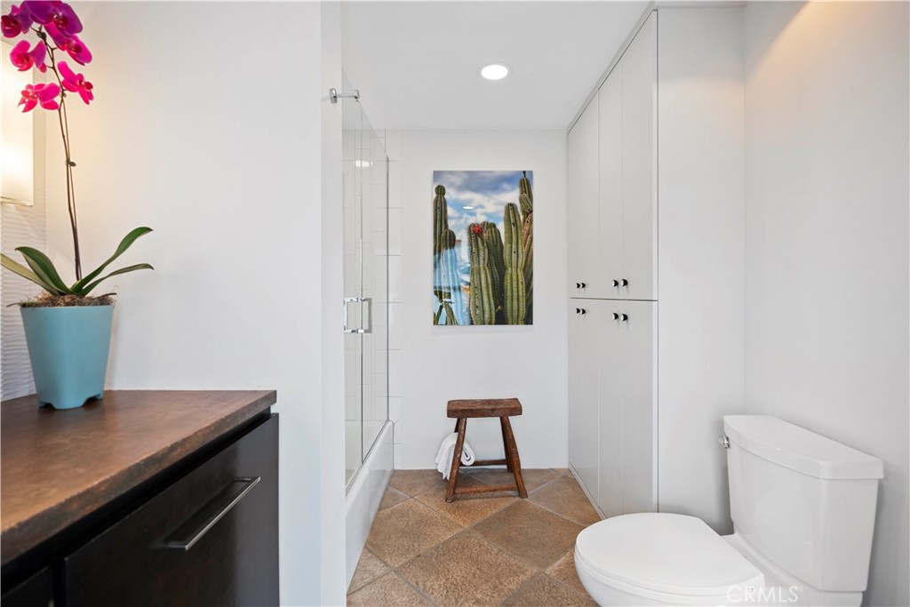 51222 Gamma Gulch Road Landers, CA 92285 - Photo 30 of 73 a bathroom with a toilet a sink and mirror