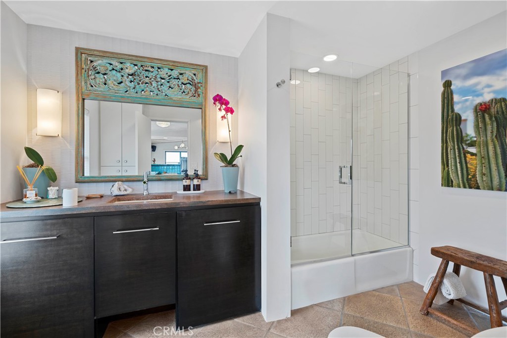 51222 Gamma Gulch Road Landers, CA 92285 - Photo 32 of 73 a bathroom with a shower sink and mirror