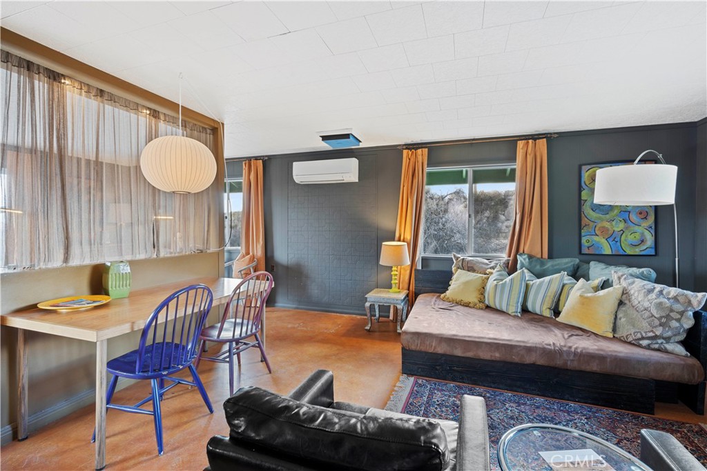 51222 Gamma Gulch Road Landers, CA 92285 - Photo 55 of 73 a living room with furniture and a large window