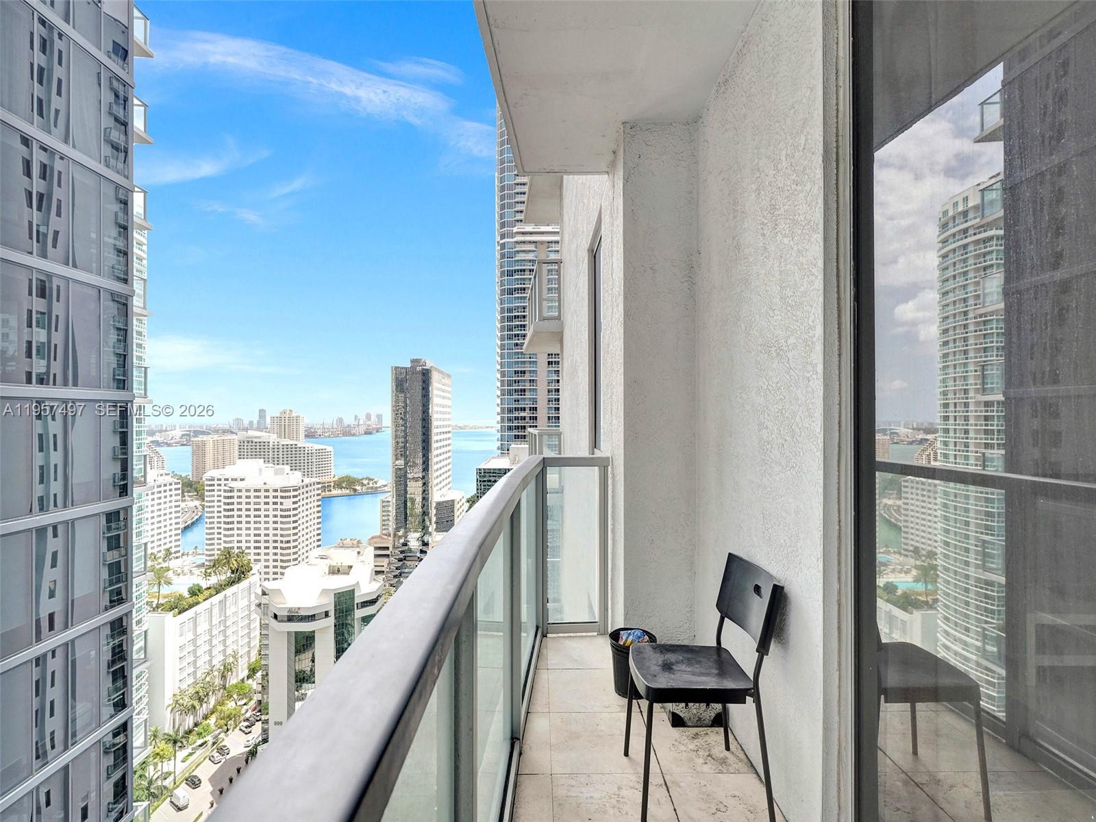 1050 Brickell Avenue, Unit 2722 Miami, FL 33131 - Photo 16 of 19 a view of a balcony with an outdoor space